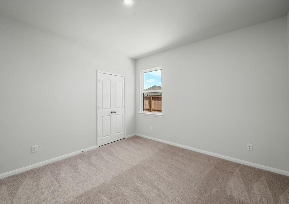 Secondary bedroom with carpet