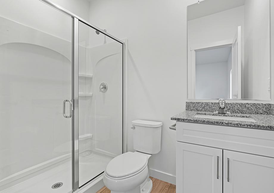 The master bathroom comes equipped with a beautiful walk-in shower