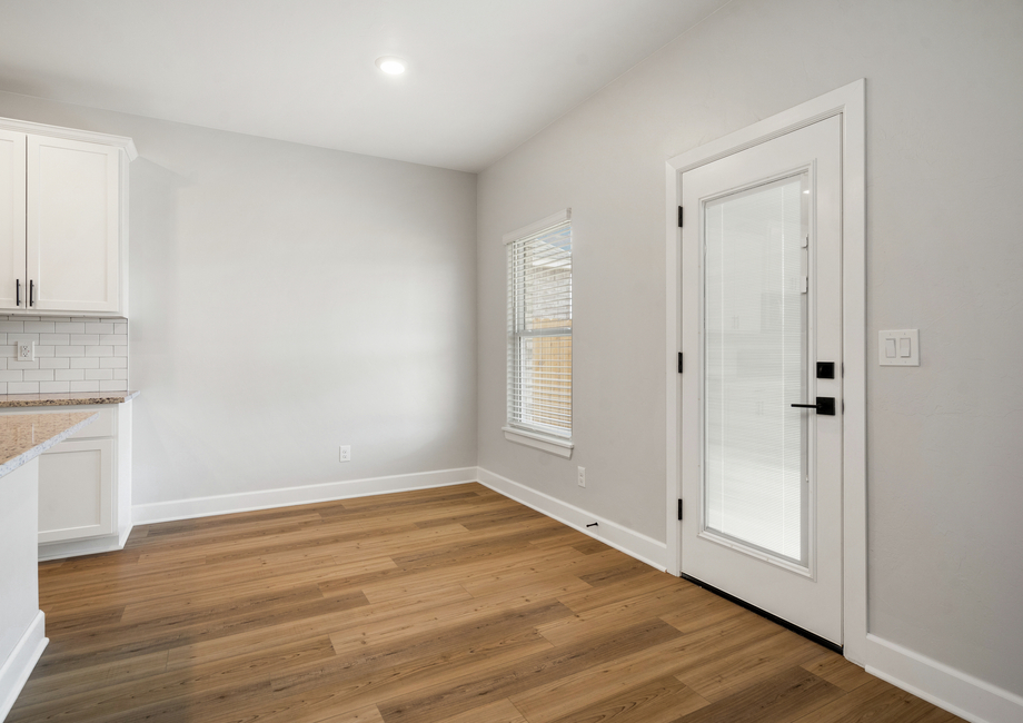 The dining room has a large window that lets in great, natural light.