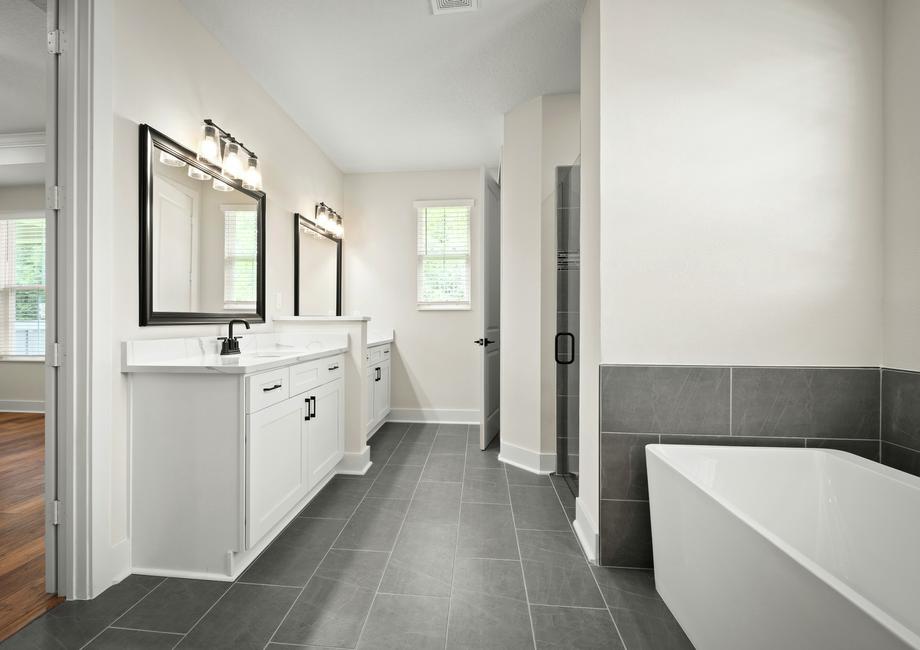 A standalone tub and walk-in shower are in the master bath.