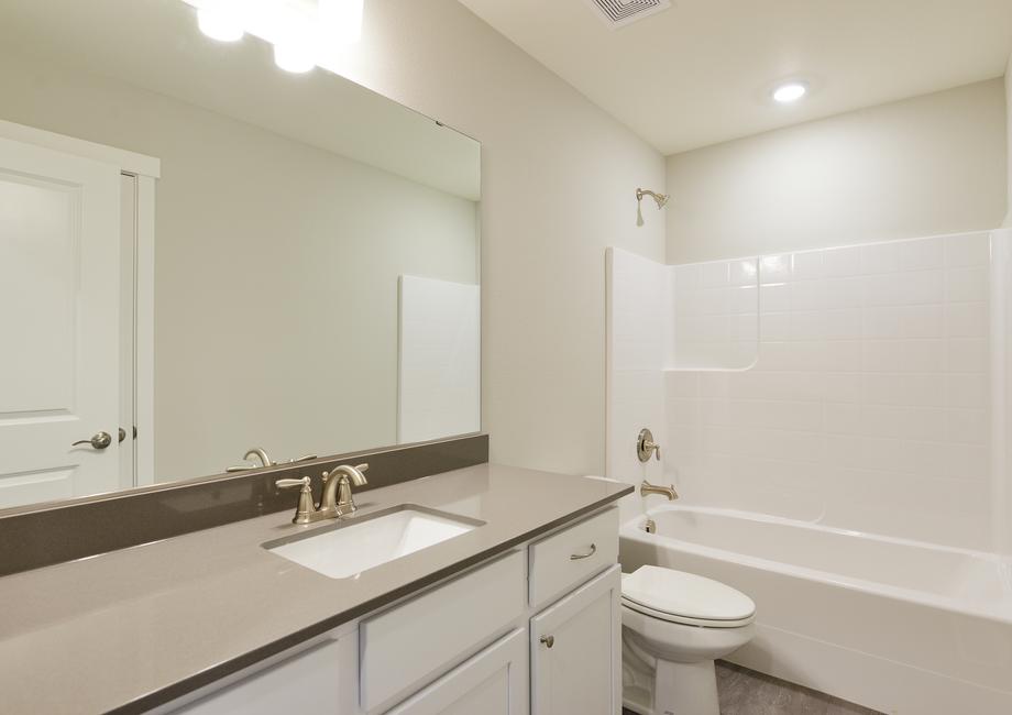 The secondary bathroom has a tub/shower combo.