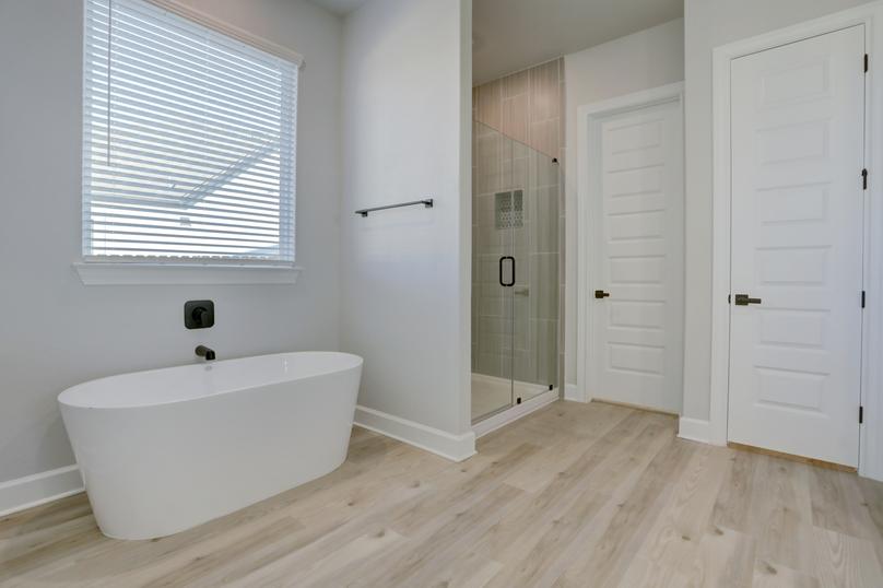 A soaking tub and walk-in shower provide a relaxing outlet to unwind.