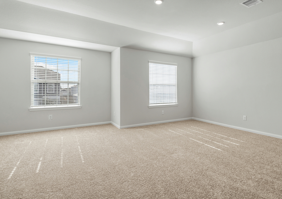 Upstairs master bedroom with two large windows