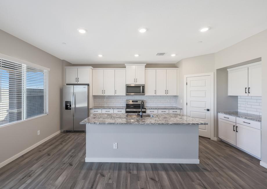 Chef-ready kitchen with a full suite of stainless steel appliances and granite countertops.
