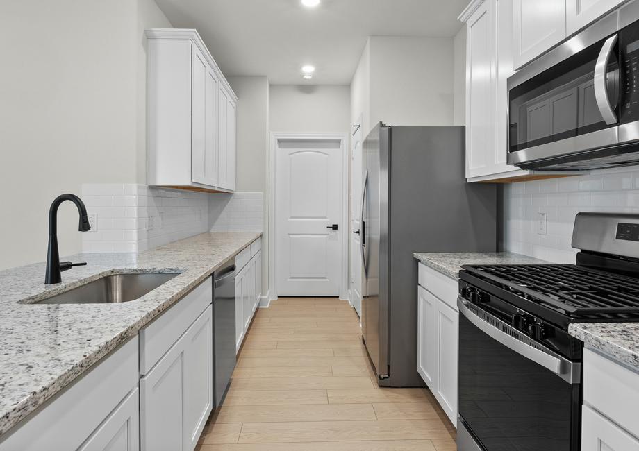 The kitchen of the Cedar has energy-efficient appliances.