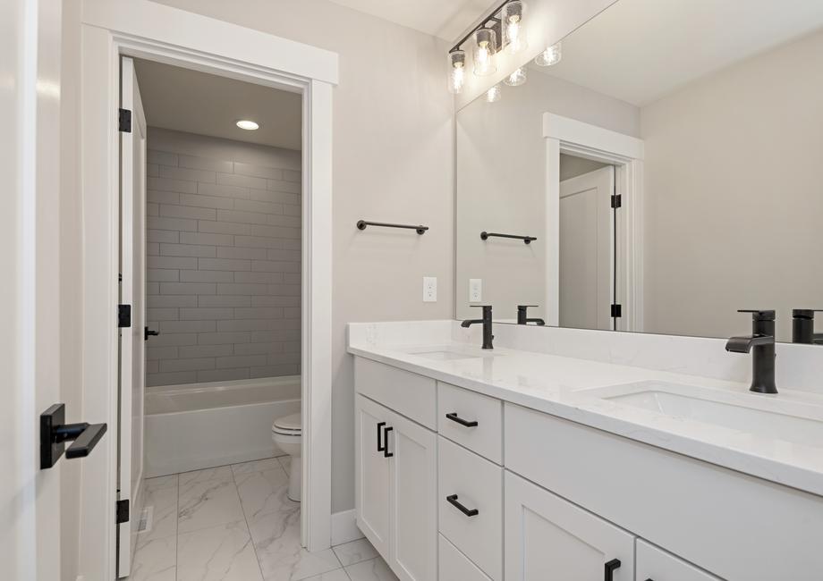 Secondary bathroom with a large vanity.