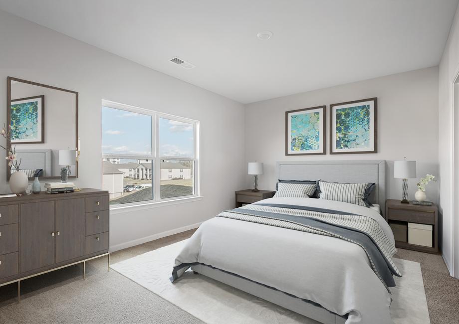 The Driftwood master bedroom has room for a large bed and bed side tables.