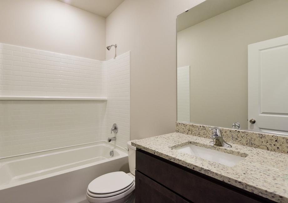 The secondary bathroom has a tub/shower combo.