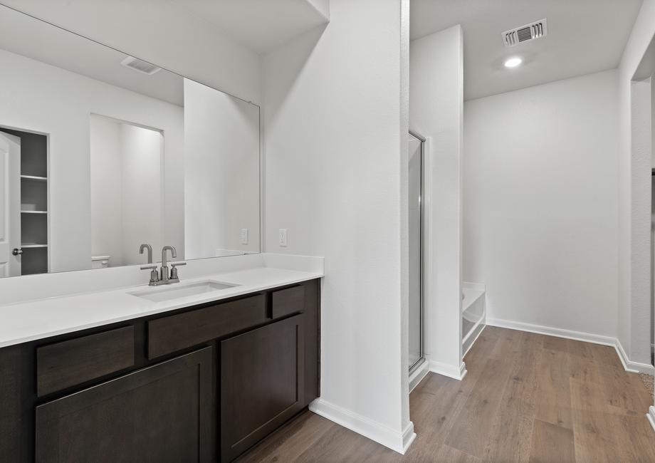 The master bathroom of the Driftwood plan has a large vanity space.