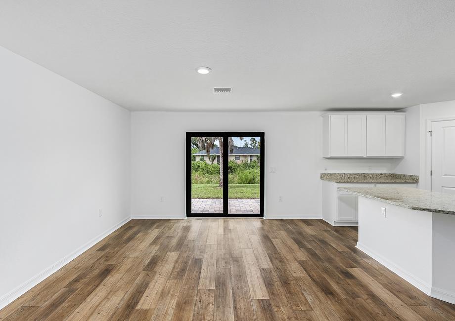 Sliding doors in the dining room that lead to the backyard.