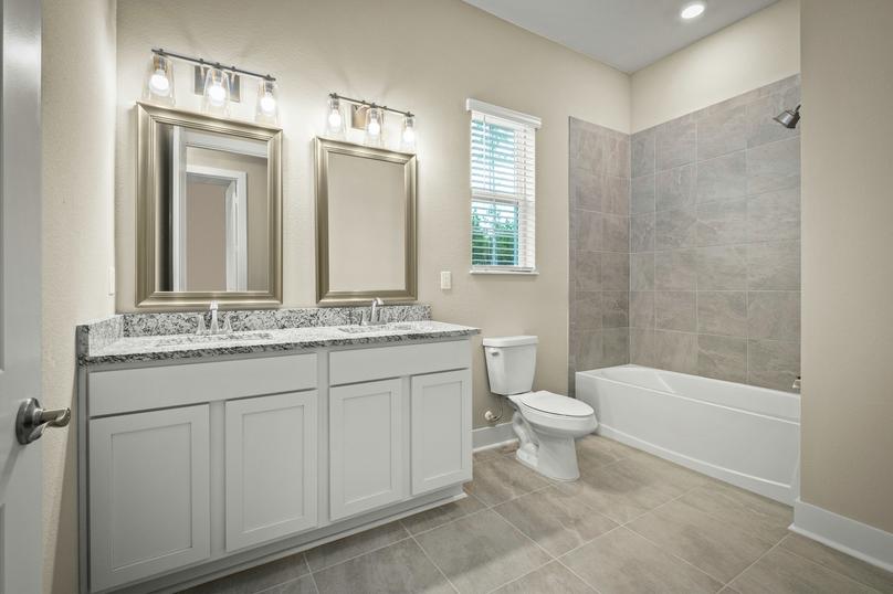 Secondary bathroom with vanity.