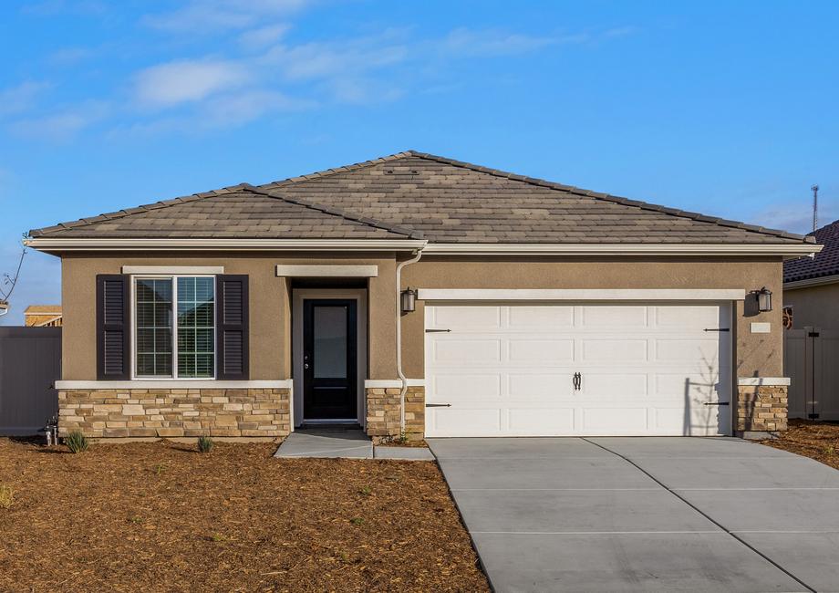 This home has a 2-car garage and gorgeous stone detailing.