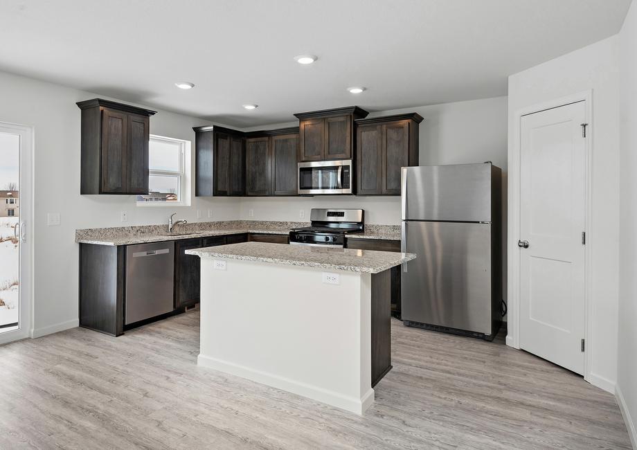 The Nicollet floor plan's kitchen has a great, uninterrupted island for more space