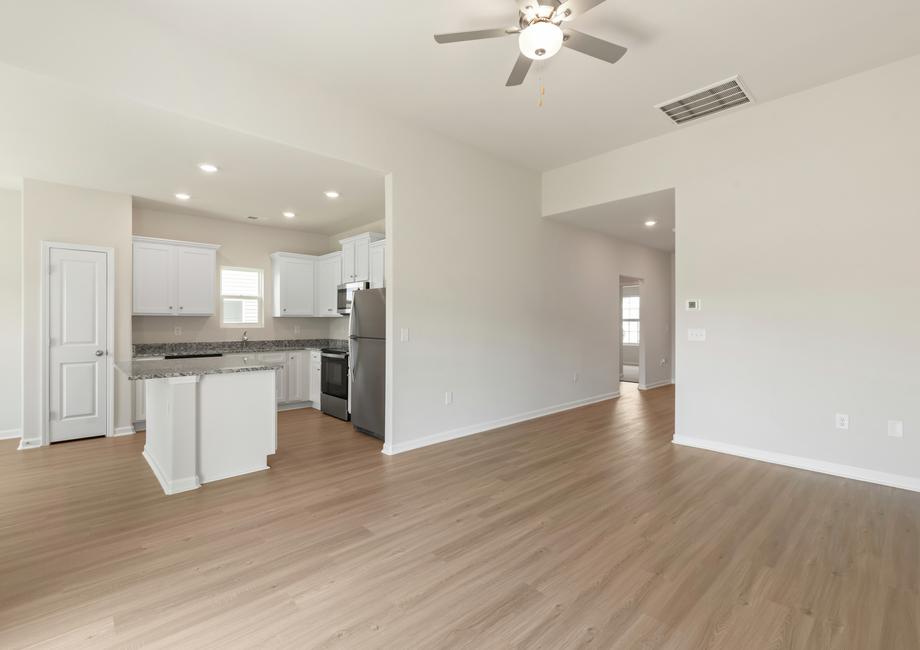 Open layout with views of the living room and the kitchen.