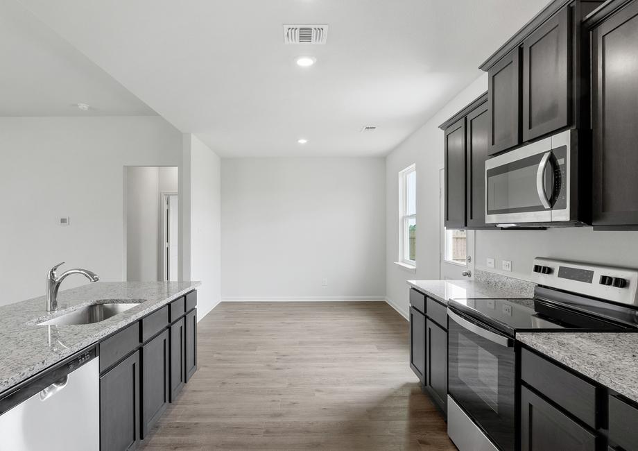 The kitchen of the Reed has sprawling granite countertops.