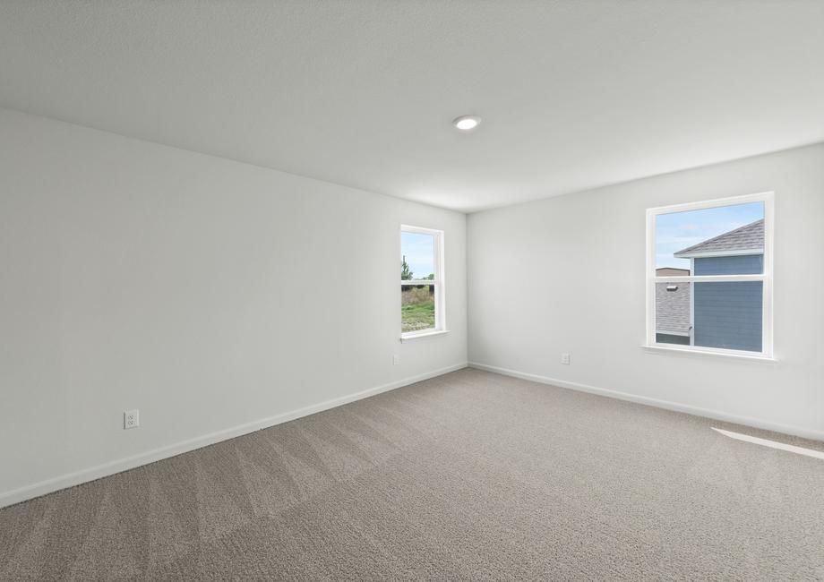 The master bedroom has large windows that let in great, natural light.