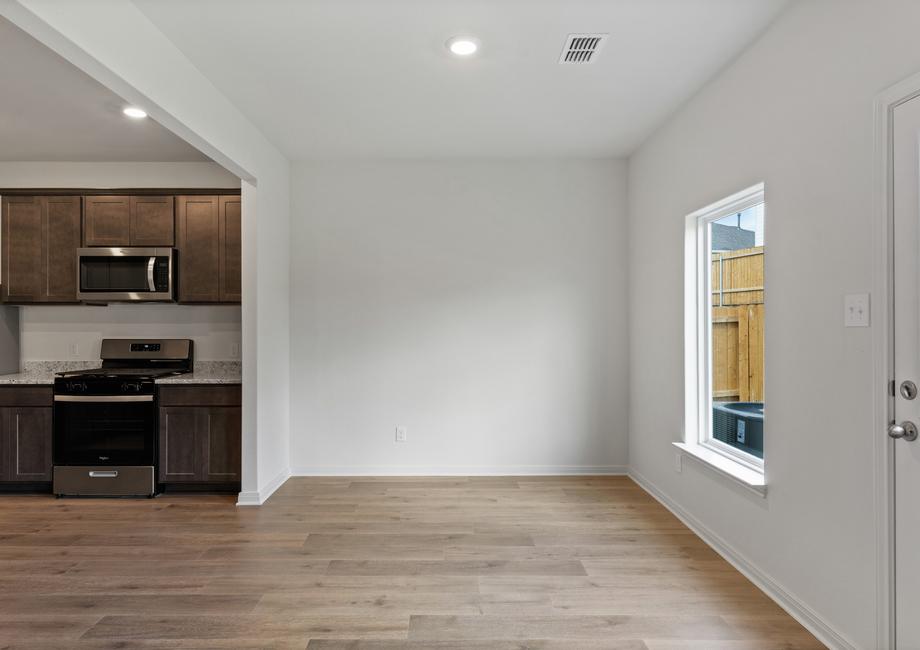 The dining room sits right off of the kitchen