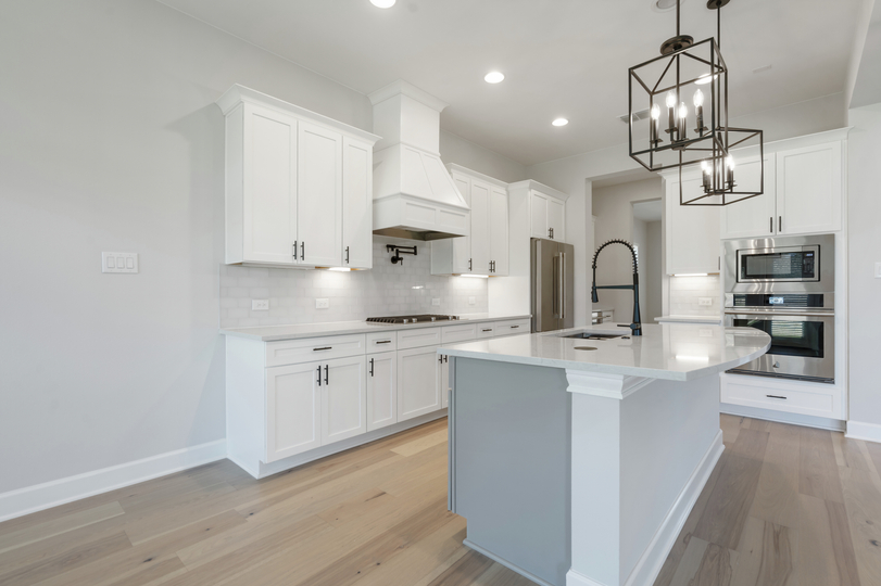 The kitchen has a beautiful tile backsplash.