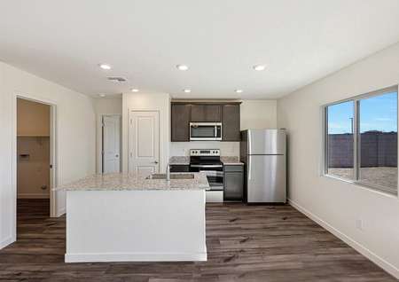 This kitchen has a beautiful granite island.