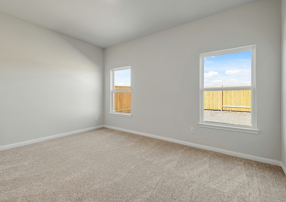 Private master bedroom with a view of the back yard