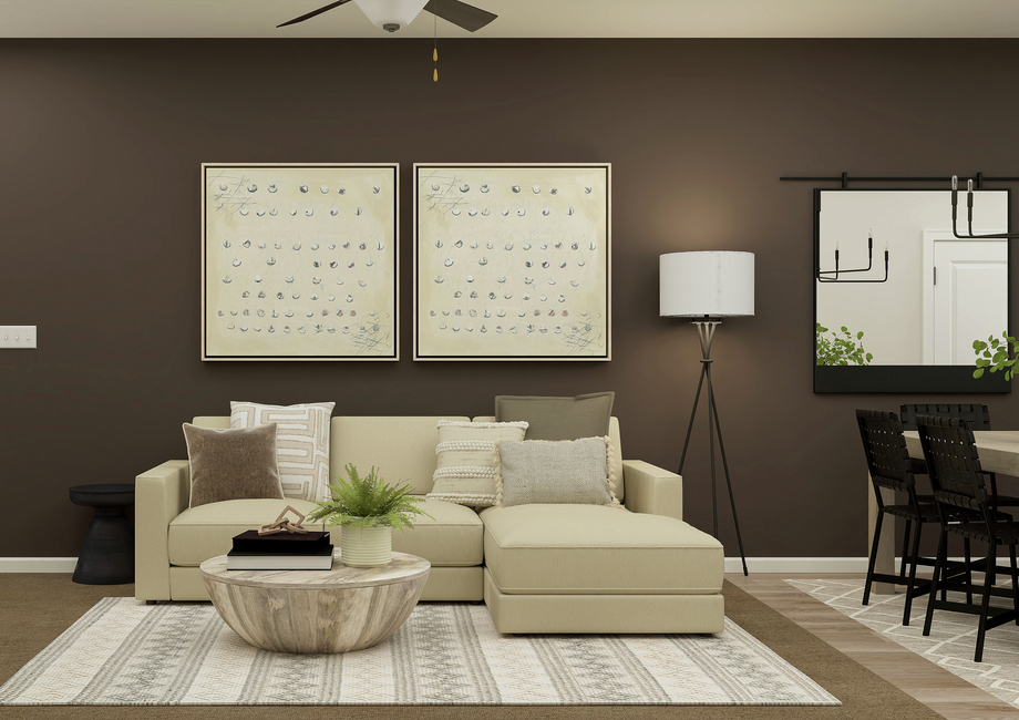 Rendering of a
  living room furnished with a white sectional couch and a round coffee table.