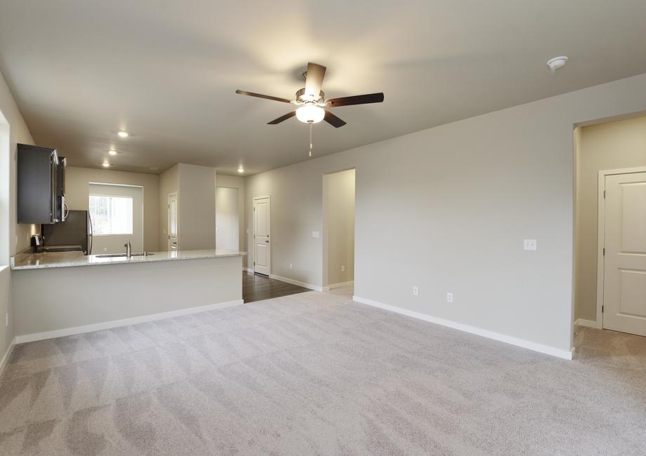 The open layout has the family room open to the kitchen.