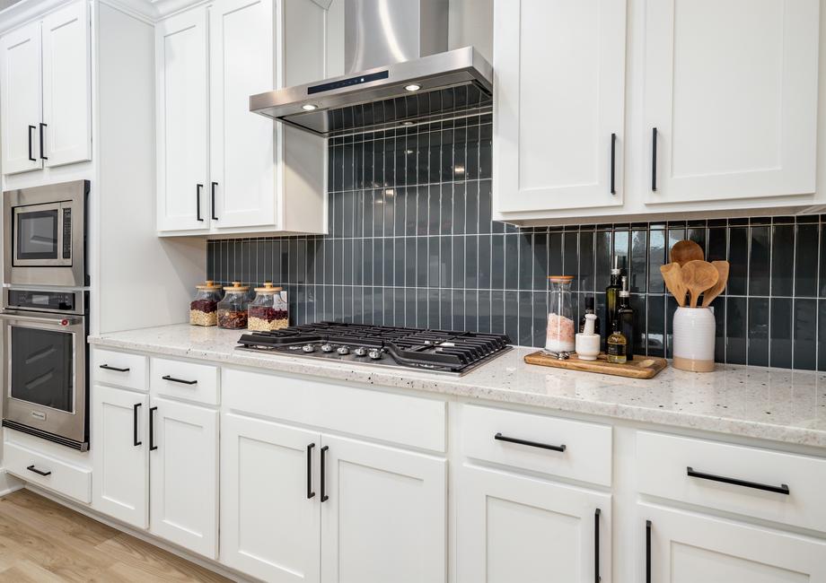 The white cabinetry comes with matte black hardware.