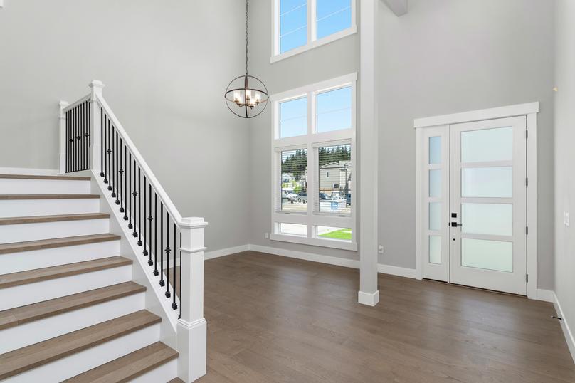 Off the entryway is a flex space for a formal dining room or an additional living space.