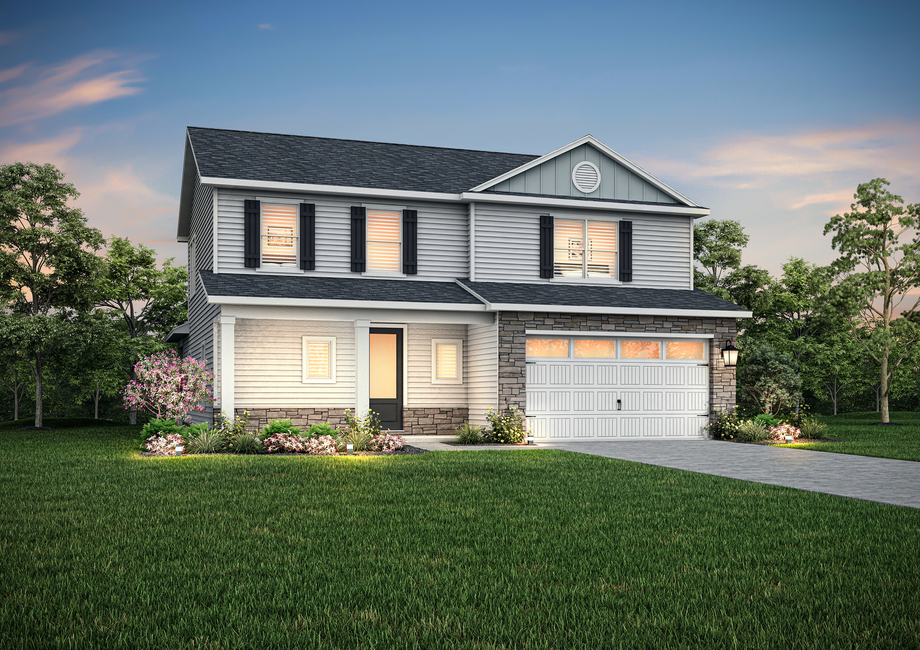 Hampton floor plan with siding and stone around the garage at dusk.