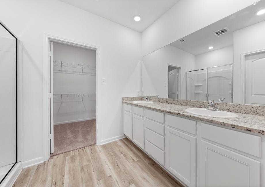 The master bathroom has a double sink vanity