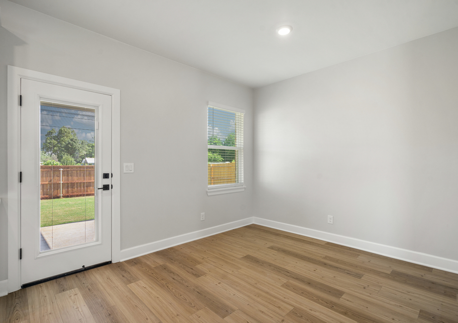 The dining room has large windows that let in great, natural light.