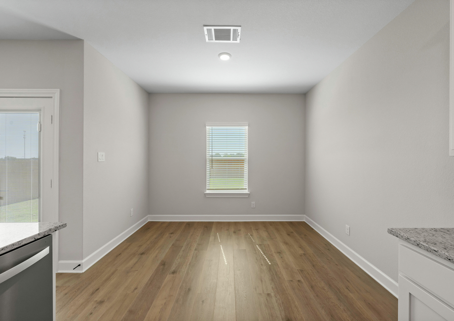 The dining room has a window that lets in great, natural light.