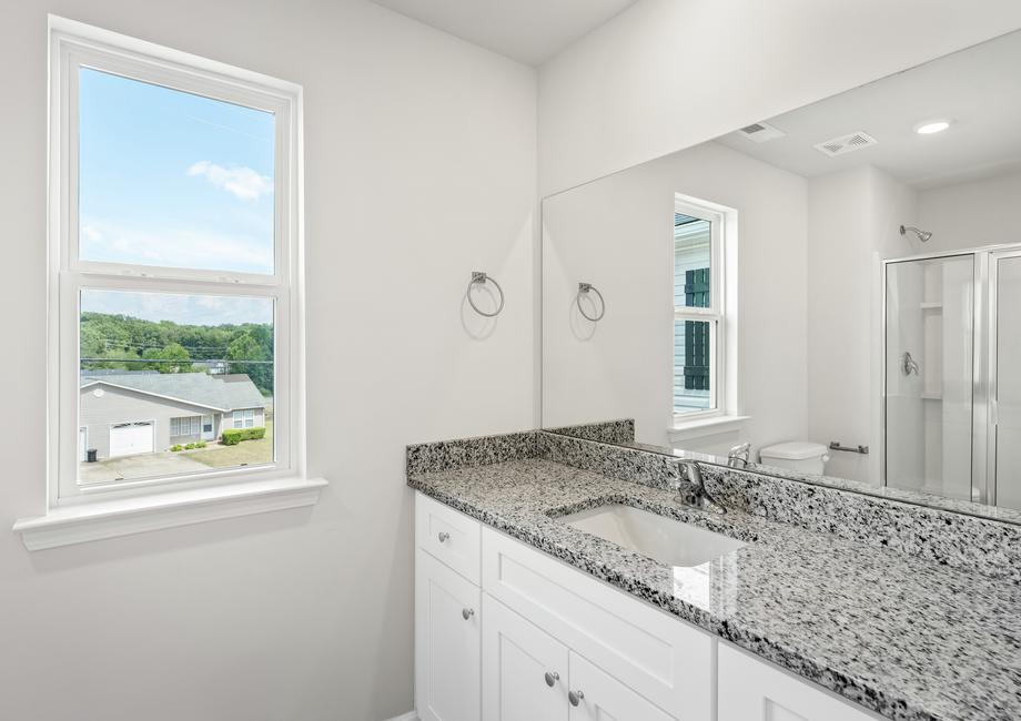 The master bathroom provides the perfect place to get ready in the morning