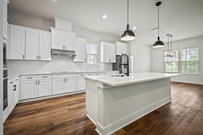 A large island is located at the center of the kitchen.