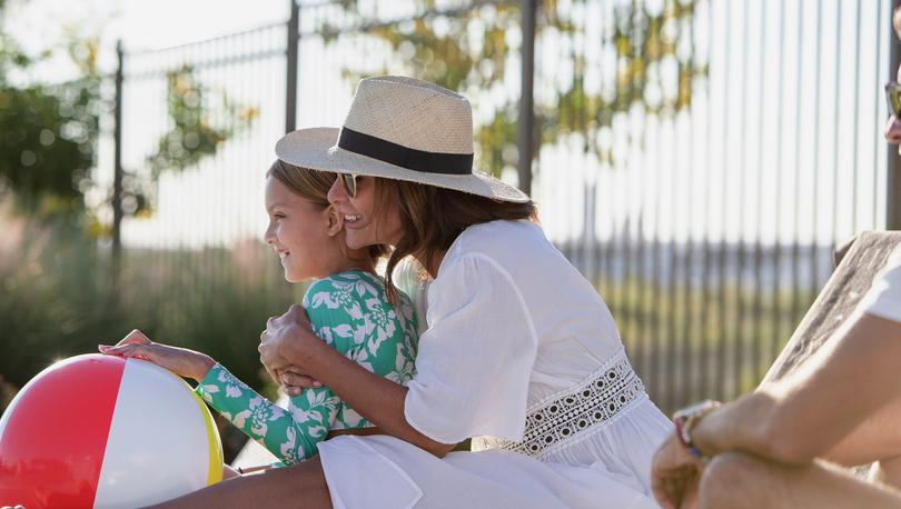 Mom and daughter with a beachball.