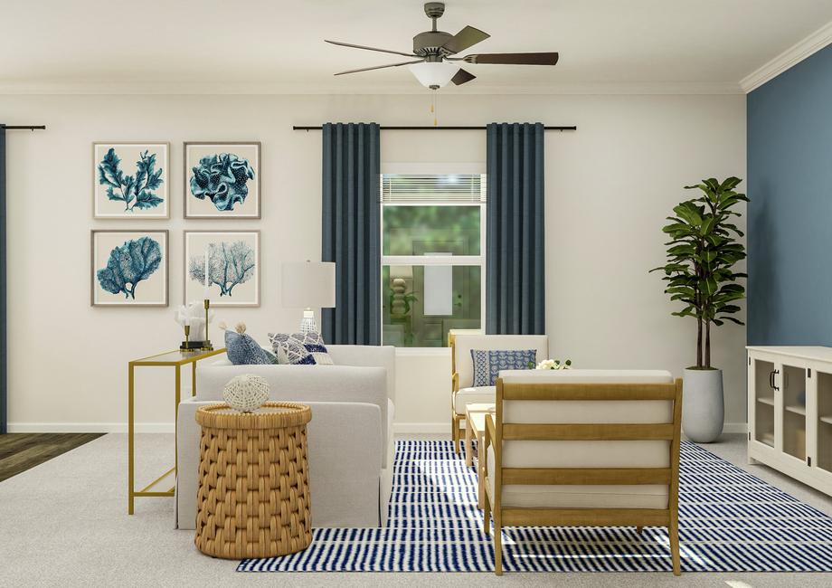 Rendering of the living room furnished  with a couch, two accent chairs and a media center. The room has a window,  carpeted flooring and a ceiling fan.