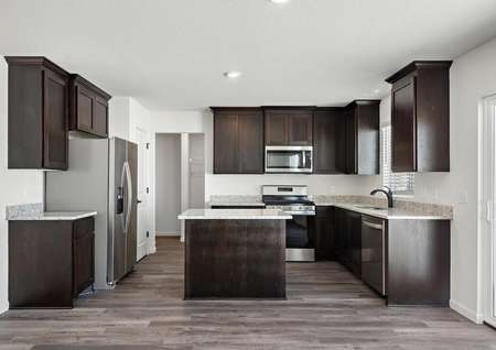 The kitchen is spacious and has stainless steel appliances
