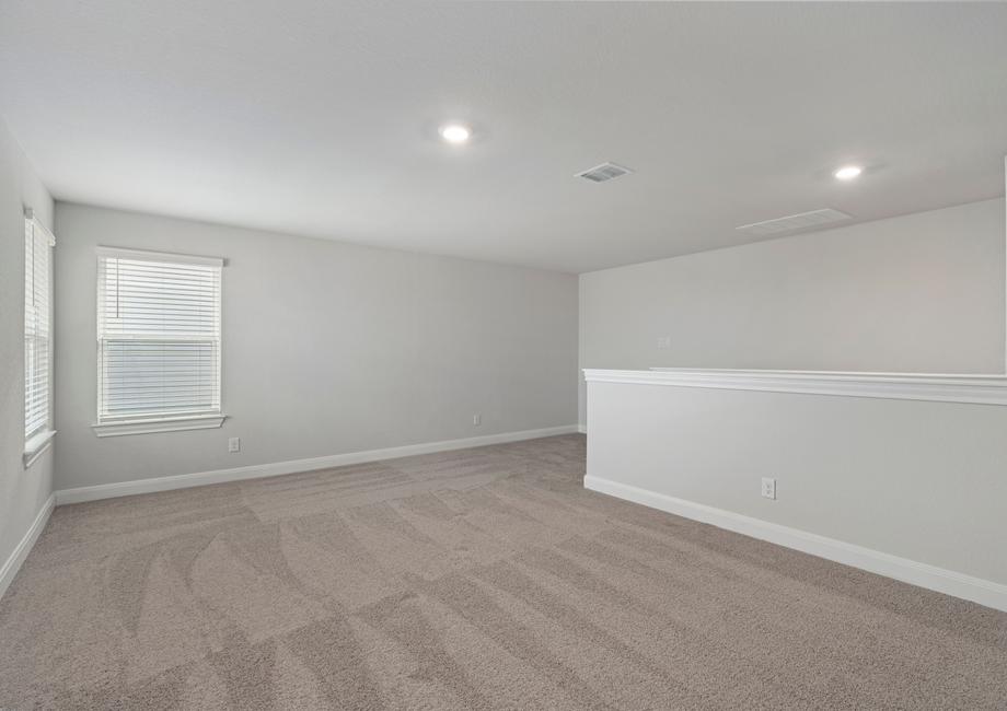 Upstairs game room with space for couches, game tables, and more.