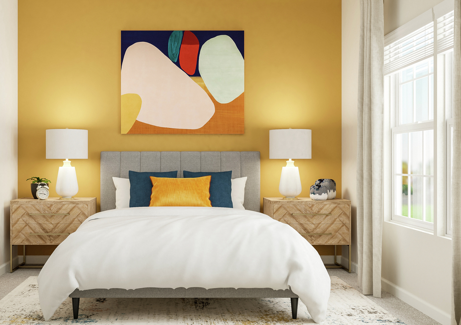 Rendering of a bedroom showing a large  bed between two nightstands. The room has a large window and carpeted  flooring.