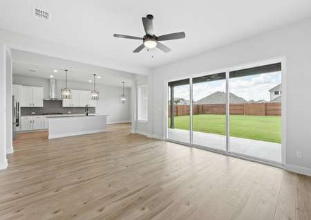 Open-concept layout with the living room opening up to the kitchen.