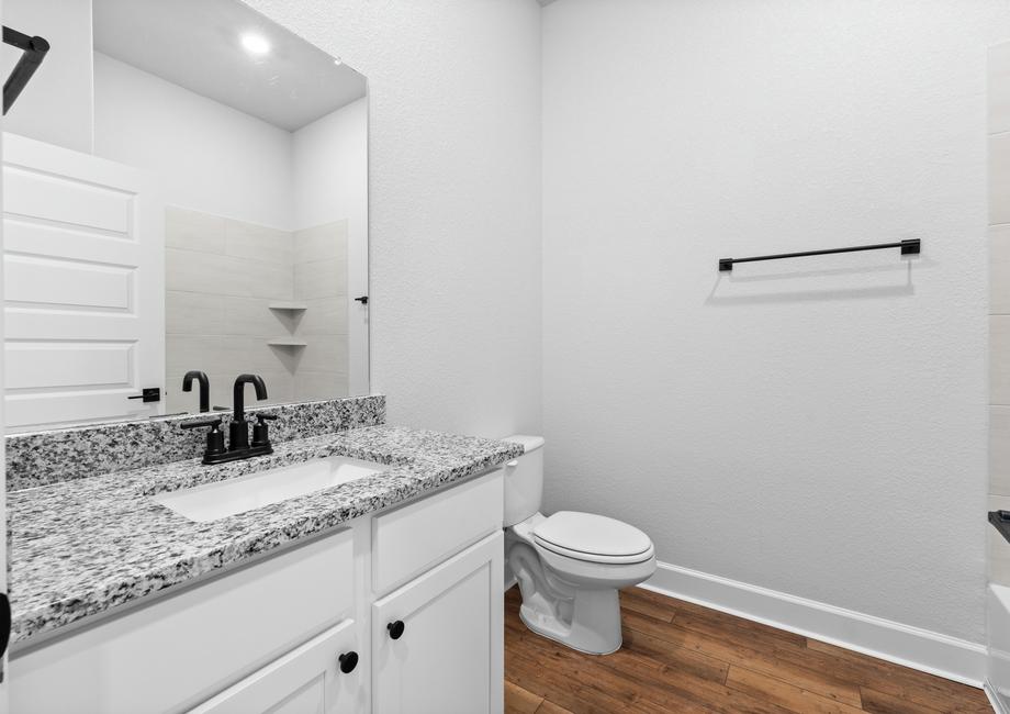 <p>Secondary bathroom showcasing designer upgrades included throughout the home.</p>