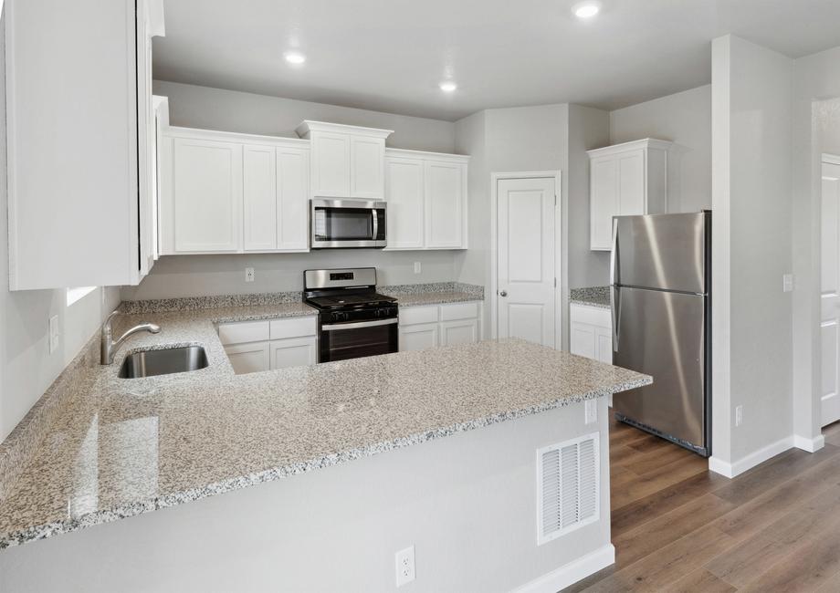 The kitchen of the Yale floor plan has sprawling granite countertops.