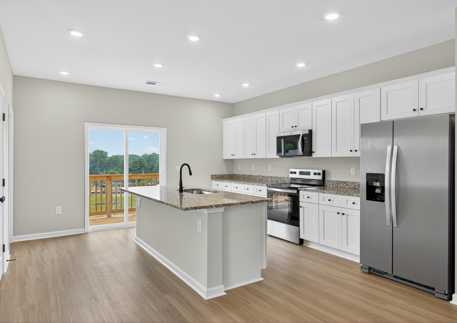 The kitchen comes with stainless-steel appliances. 