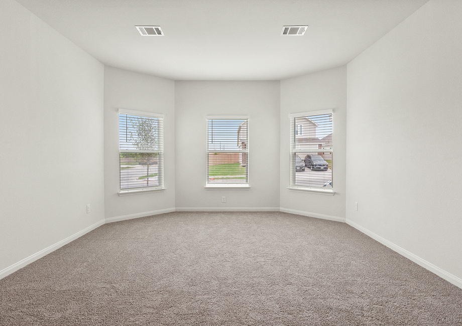 The master bedroom of the Cypress has three large windows that let in great natural light.