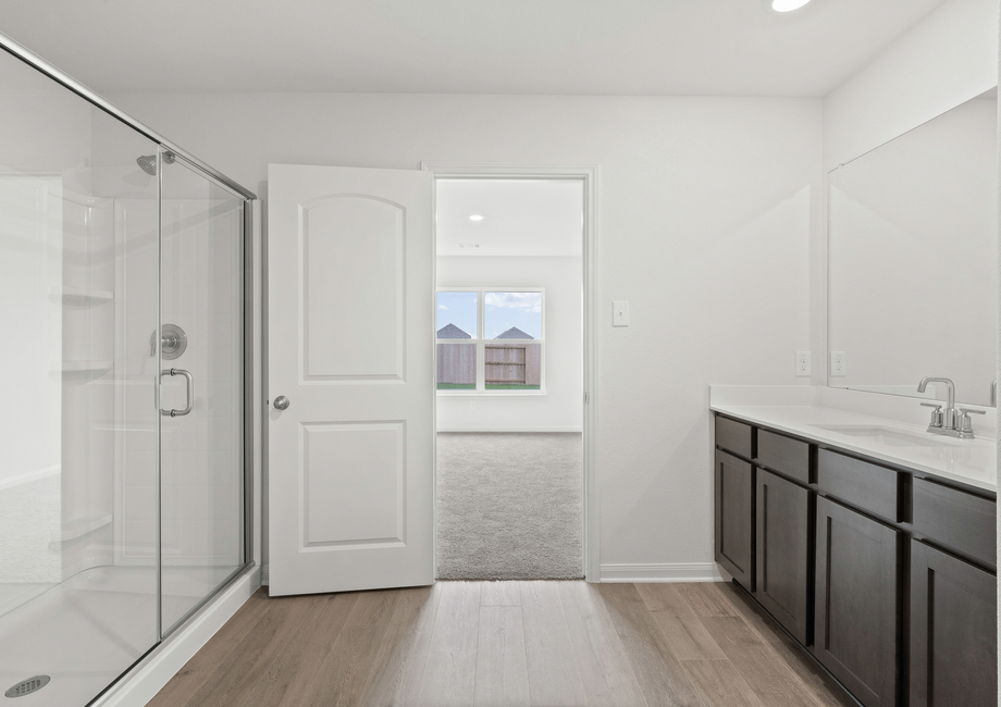 The master bathroom of the Blanco has a large glass walk-in shower.