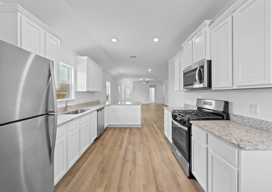 Kitchen with white cabinets and stainless steel appliances