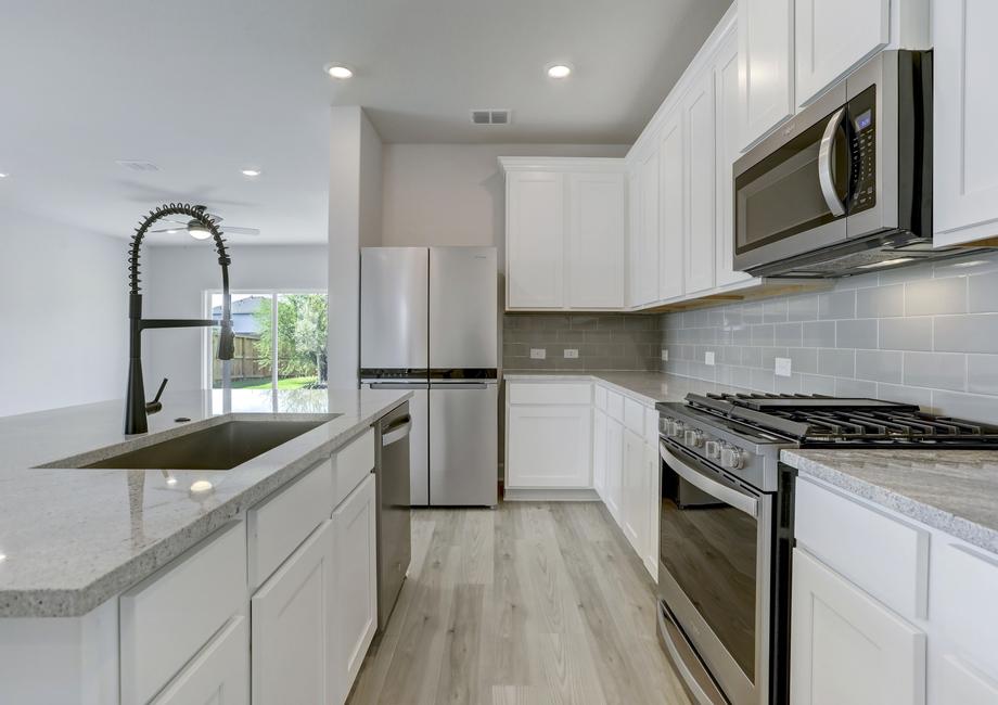 Upgraded kitchen with stainless appliances.