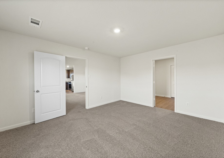 The master suite has a large bedroom, ensuite bathroom and walk-in closet.