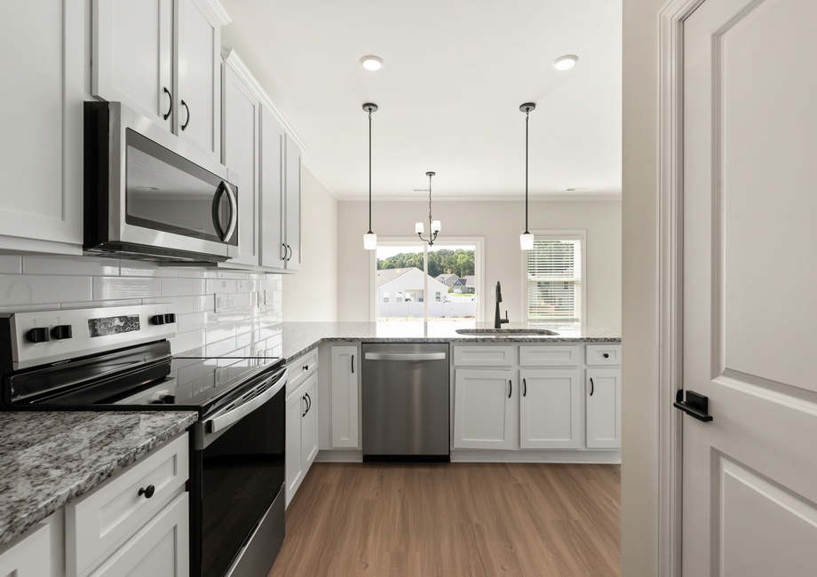 The kitchen overlooks the living area