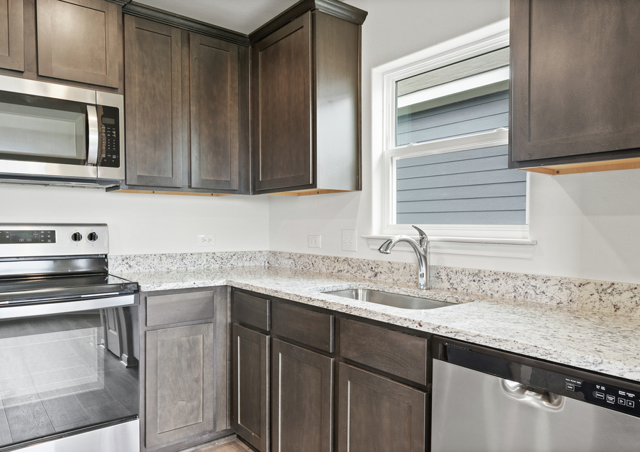 The kitchen of the Blanco has beautiful wood cabinetry.